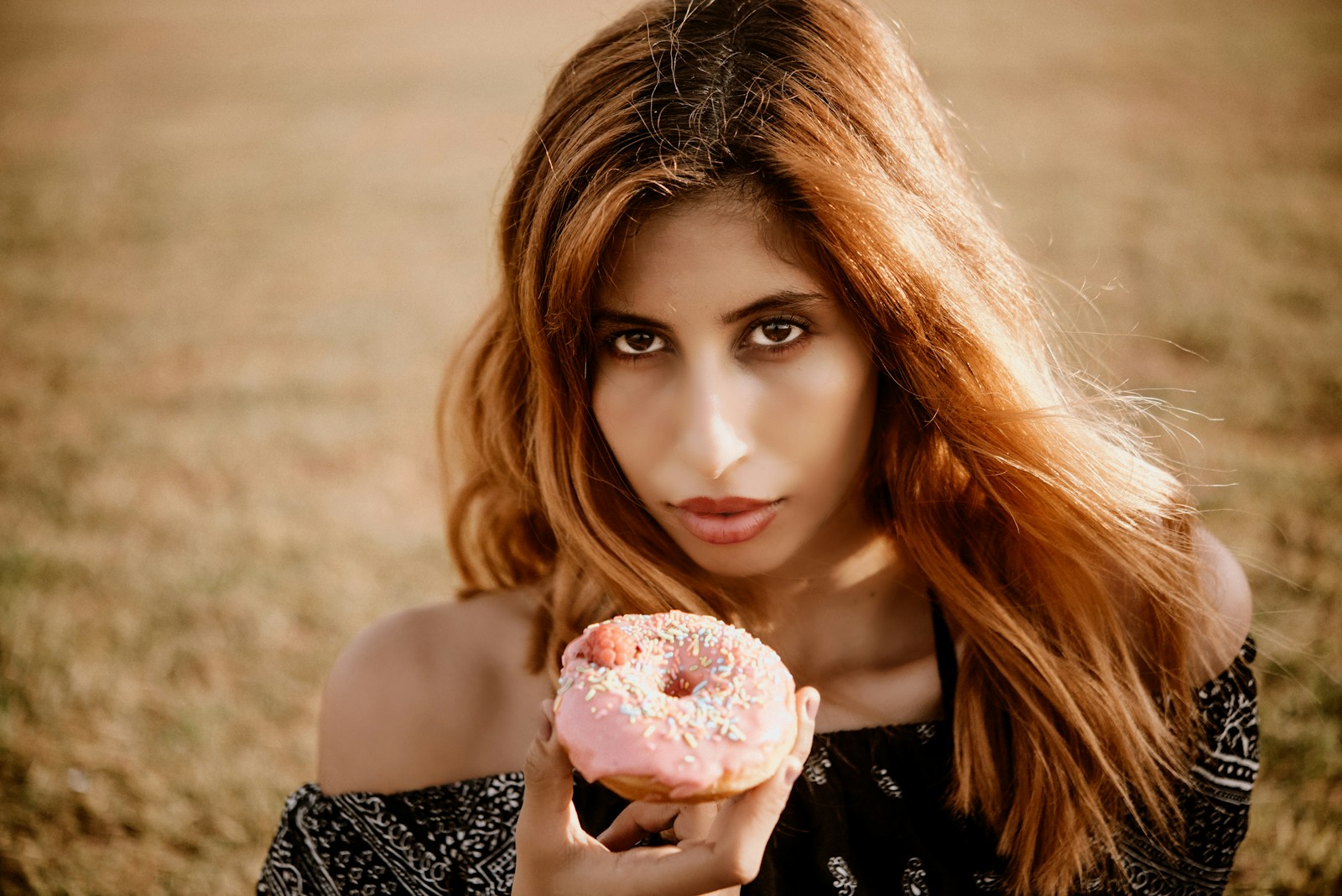 woman in black and white tank top holding ice cream